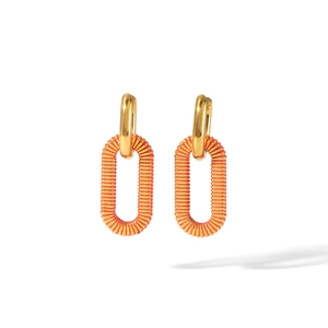 Detail of 18k gold earrings featuring orange enamel stripe patterns and wave texture