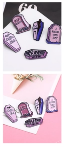 Detailed view of Gothic purple enamel coffin pins with Rip Feelings and Dead Inside text