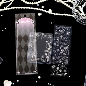 Detail of laser silver ribbon rose stickers with decorative black grid card holder