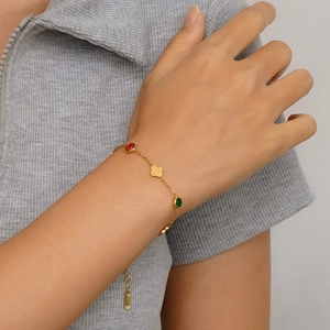 Minimalist 18K gold plated stainless steel clover bracelet with red and green gems