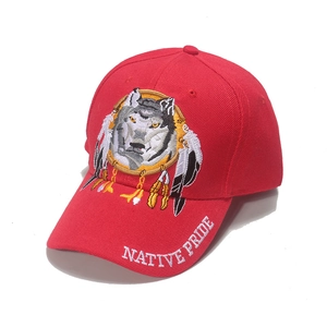 Red baseball cap with wolf embroidery and Native Pride text for sun protection