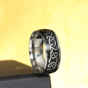 Men's black and silver stainless steel Celtic knot ring with hollow patterned design