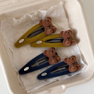 Detail of cute flocked bear hair clips in ginger and blue with silver 'Love' metal charms