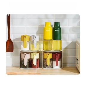 Kitchen organizer set featuring glass seasoning jars and oil bottles on a white rack