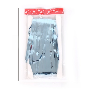 Close-up of blue foil fringe curtain packaging with dimension markings 28cm x 15.5cm
