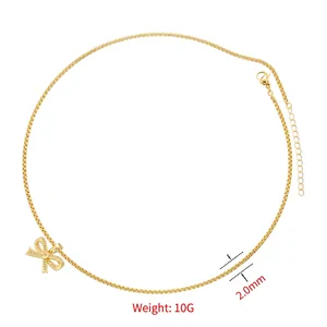 Elegant gold bow pendant necklace with sparkling rhinestones and adjustable cross chain