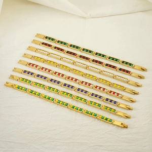 Set of 8 gold beaded bracelets for women with multicolor resin beads on white background