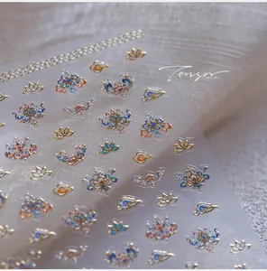 Detailed view of Chinese style nail stickers with golden lotus and cloud patterns