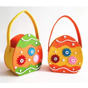Easter felt gift baskets with colorful egg designs and flower decorations for candy treats