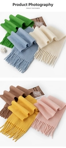 Detail of knit scarves with fringe in vibrant green blue cream and warm autumn tones