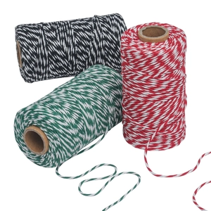 Three rolls of decorative two-tone braided cotton twine in red, green, and black for gifting