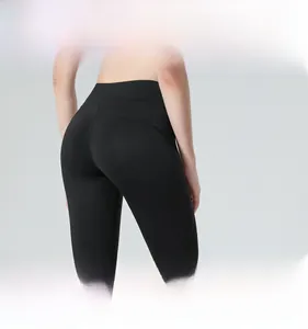 Rear view of high-waisted black yoga shorts showing peach lift effect and matte fabric