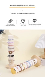 Detail of colorful scrunchies and pearl hair ties on velvet jewelry display stands