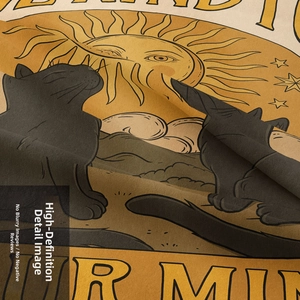 Close-up of bohemian tapestry fabric showing vintage sun and black cat print details