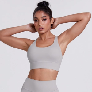 Close-up of light grey cross-back sports bra and high-waist yoga leggings set