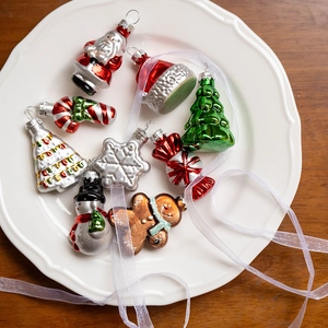 Christmas glass ornaments set featuring Santa, snowman, and tree in a decorative white dish