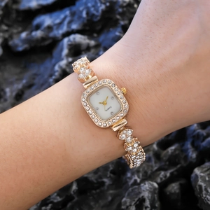Luxurious gold square quartz watch for women featuring shimmering rhinestone accents