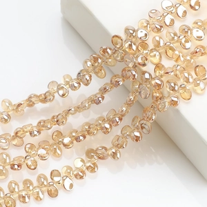 Close-up of faceted amber crescent crystal glass beads for DIY jewelry making