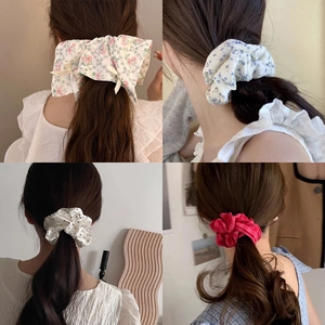 Collage of large double-layer floral lace scrunchies in four stylish patterns for women