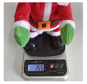 Gewichtsmessung vom tanzenden Weihnachtsmann Spielzeug zeigt 355g auf digitaler Waage
