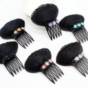 Detail of 6 black hair volume pads with colorful floral accents on a white background