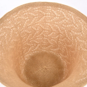 Detailed close-up of breathable hollow knit structure on a brown women sun bucket hat