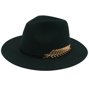 Detailed close-up of dark green wool fedora with a large golden leaf metal buckle decoration