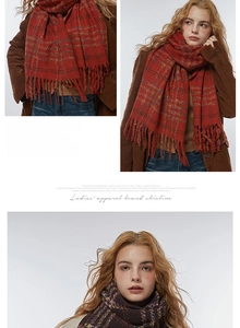 Detailed view of striped plaid scarf fringes with soft red and brown checkered texture