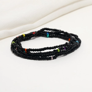 Close-up of double-layered black and colorful seed beads for waist and beach jewelry