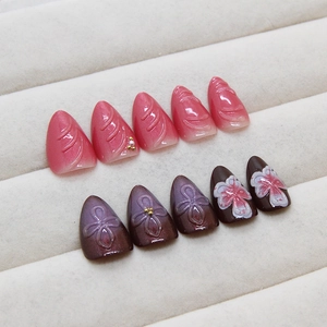 Chinese style press-on nails set with 3D flowers, pearls and cat-eye finish on velvet tray