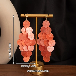 Detail view of colorful shell tassel earrings showing size 8.7cm and weight 11g details