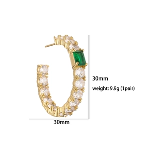 Detailed view of 30mm gold C-shaped earrings with emerald zircon and 9.9g weight info