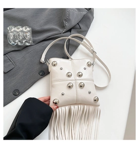 White rivet crossbody bag featuring long fringe tassels and a minimalist square design