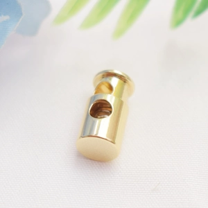 Detailed close-up of 14K gold plated spring cord lock stopper for DIY jewelry making