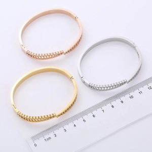 Polished triangle cuff bracelets with rhinestones in rose gold, gold, and silver finishes