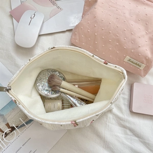 Detail view of floral print and quilted cotton makeup bags with large inner capacity