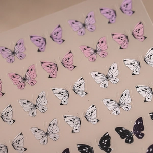 3D butterfly nail art stickers with realistic wings on a warm minimalist background