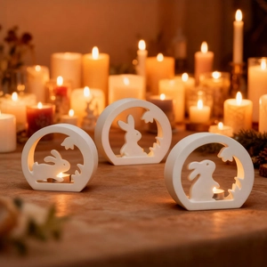 Three white ceramic bunny silhouette candle holders for Easter table decor