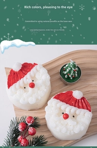 Close-up of Santa Claus and Christmas tree scented candles on a wooden wave tray