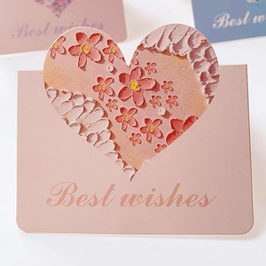 Close-up of pink heart-shaped card with 3D embossed floral oil painting and Best wishes text