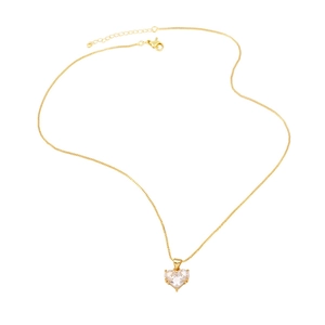 Elegant gold heart pendant necklace with clear zircon crystals on white background