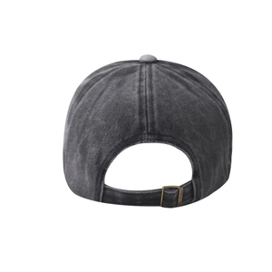Detail of adjustable metal buckle and vintage washed cotton texture on the baseball cap