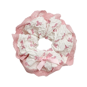 Ballet-style white lace scrunchie with pink ribbon patterns and a cute bow