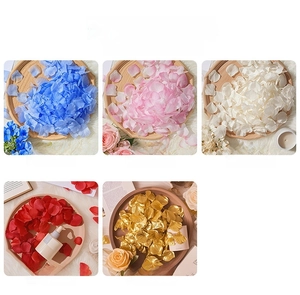 Detail showing artificial rose petals in five colors including blue, pink, and red