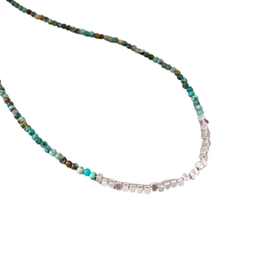 Ethnic beaded necklace with turquoise and brown stones and silver accent beads
