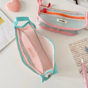 Close-up of mesh pencil case showing breathable texture and durable zipper details