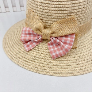 Straw sun hat with pink plaid ribbon bow decoration for summer outdoor protection