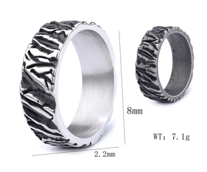 Macro detail of industrial style textured ring with 8mm width and antique silver finish