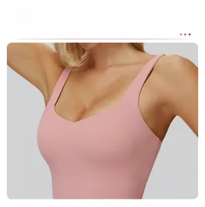 Close-up of pink yoga bodysuit featuring a diamond neckline to highlight the collarbone