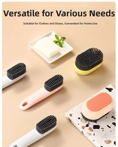 Detail of long-handled shoe cleaning brushes with soft bristles in multiple colors
